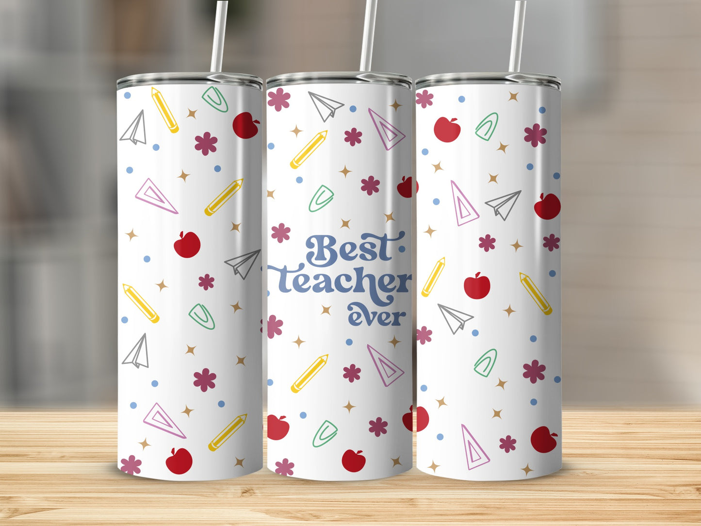 Teacher tumbler with "Best Teacher Ever" and school-themed graphics.