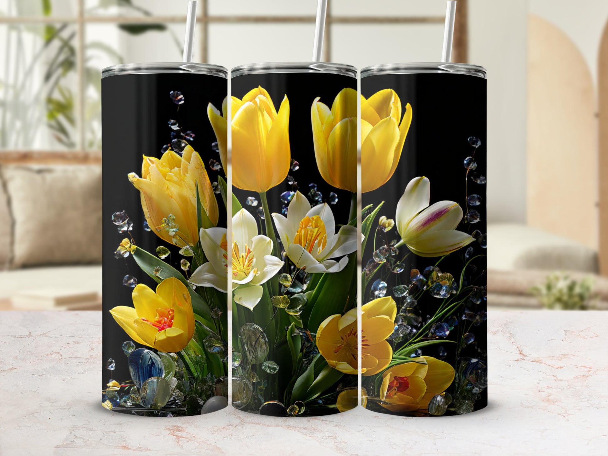 Black tumbler with yellow tulips and white daffodils, surrounded by gems.