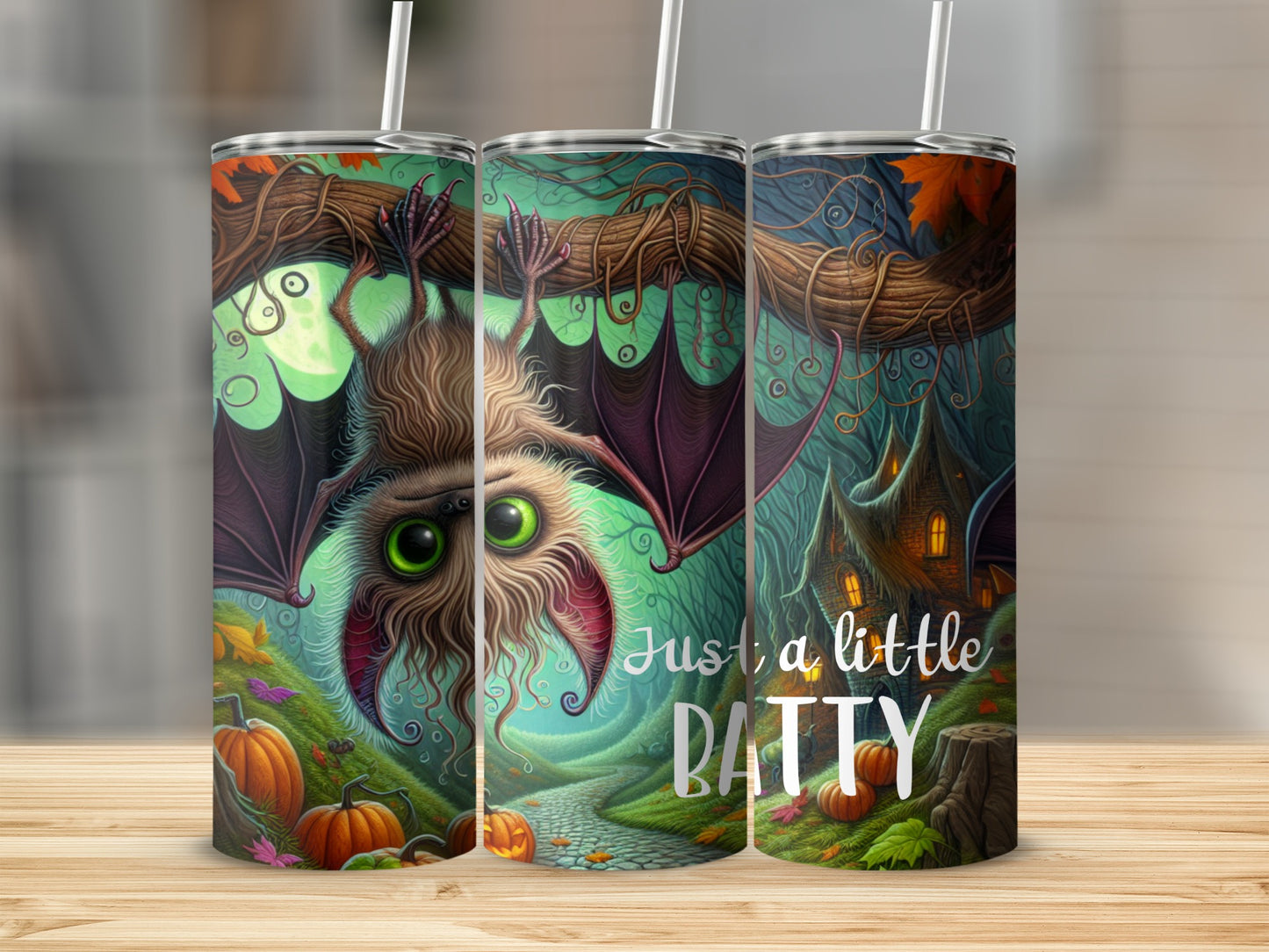 Tumbler with a bat, pumpkins, and a spooky house, reads "Just a little BATTY".