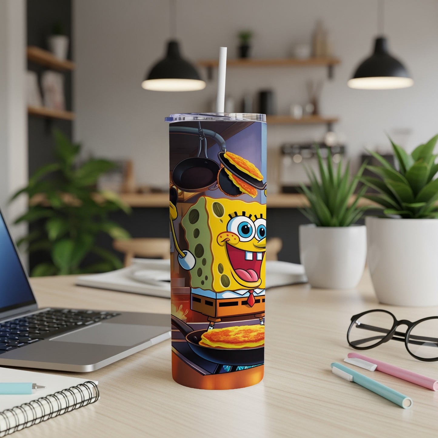 SpongeBob SquarePants on a tumbler, cooking pancakes on a stovetop.