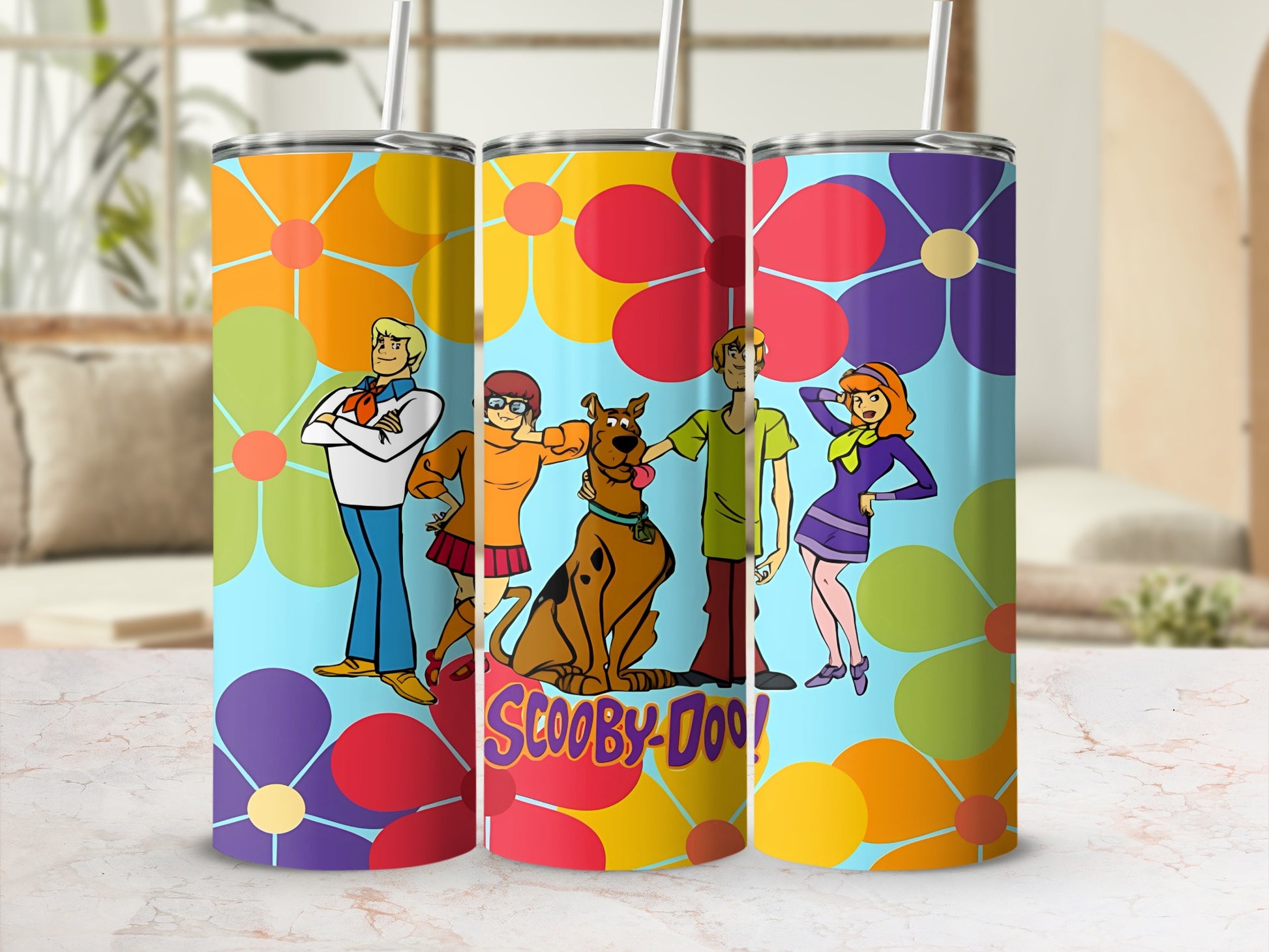 Scooby-Doo characters on a colorful floral tumbler.