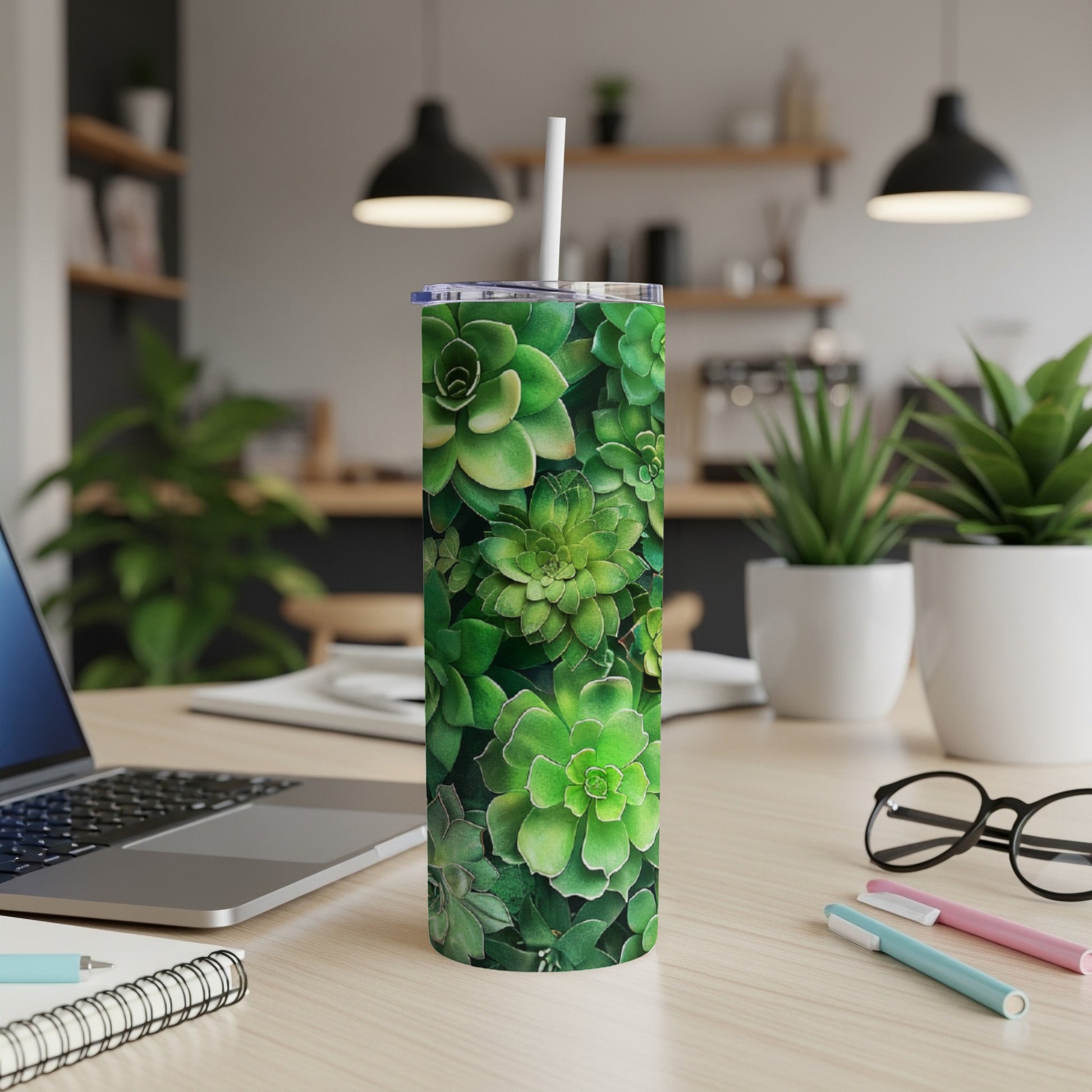Green succulent plants pattern on a white tumbler with a straw.