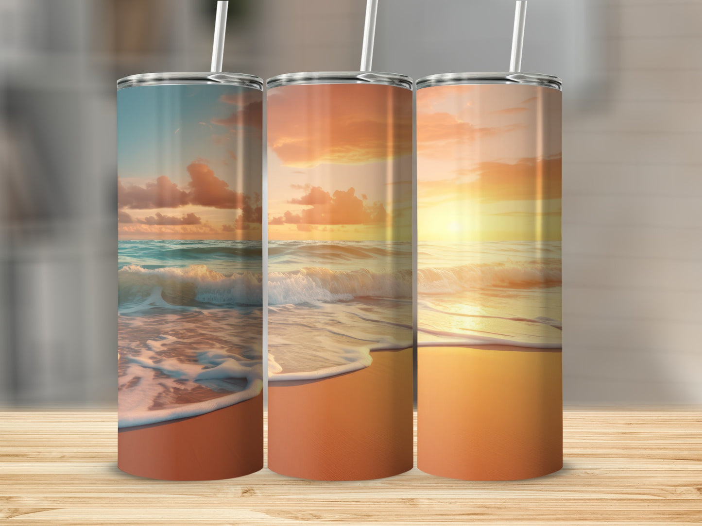 Three tumblers with a sunset beach scene, waves on shore.