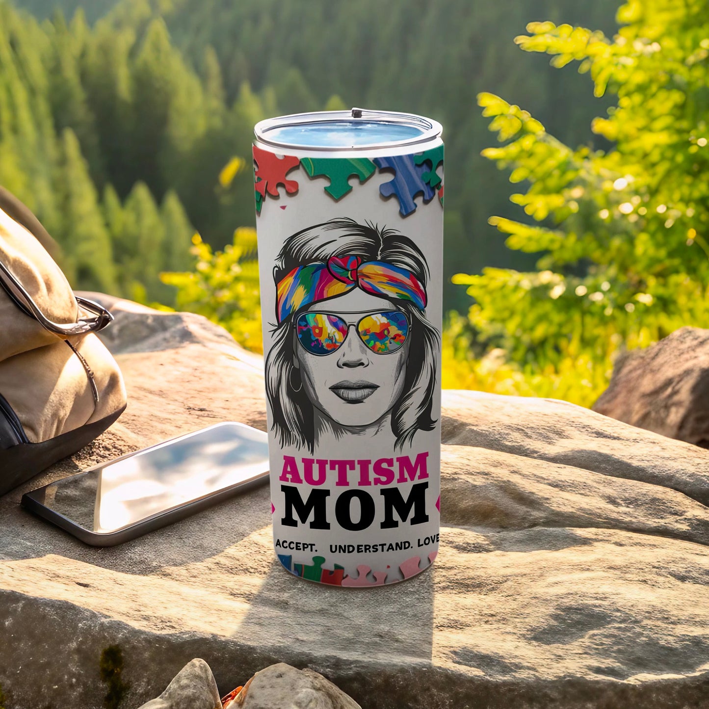 Autism Mom tumbler with puzzle piece border and sunglasses.