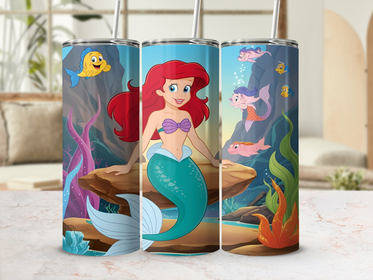 Ariel the mermaid on a rock with Flounder and other sea creatures in a coral reef.