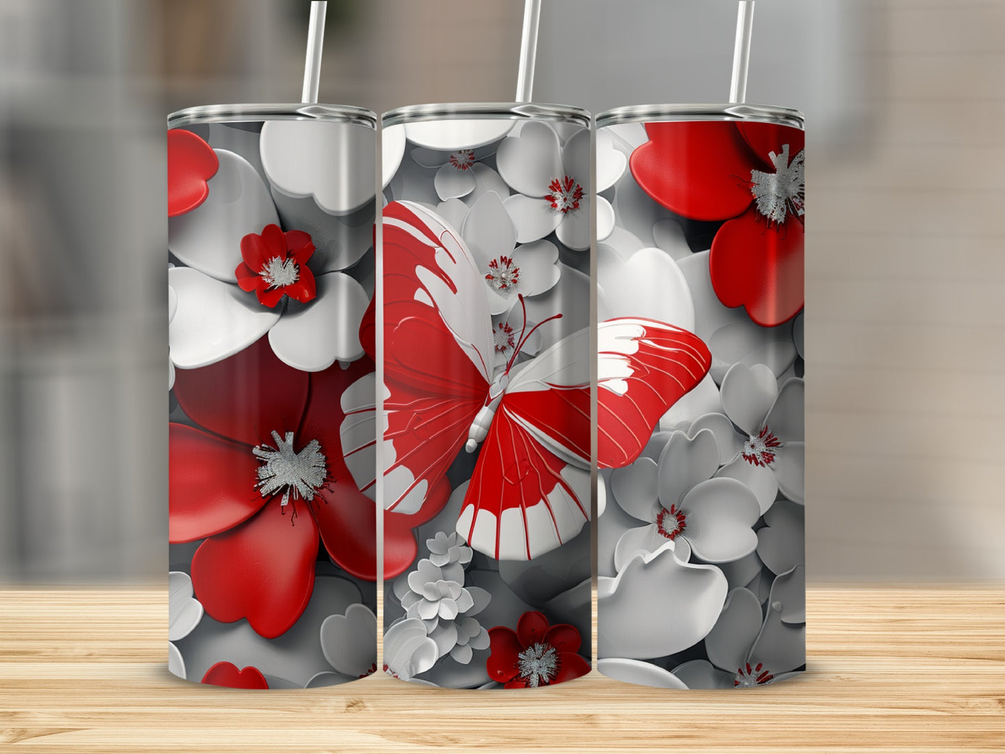 Three tumblers with red and white butterflies and floral designs.