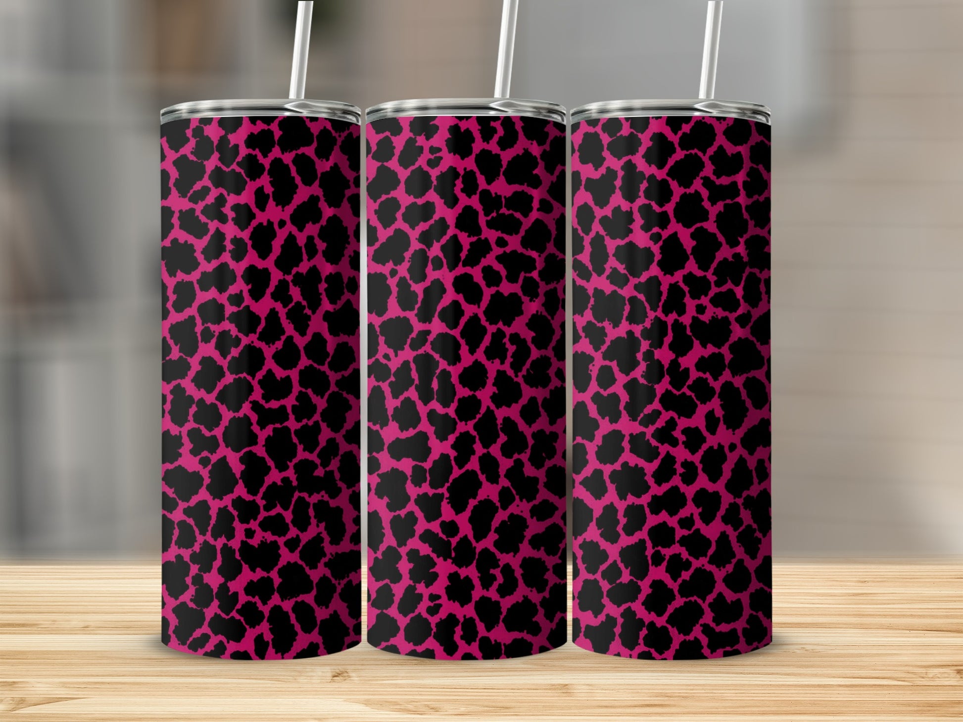 Three tumblers with a black leopard print on a hot pink background.