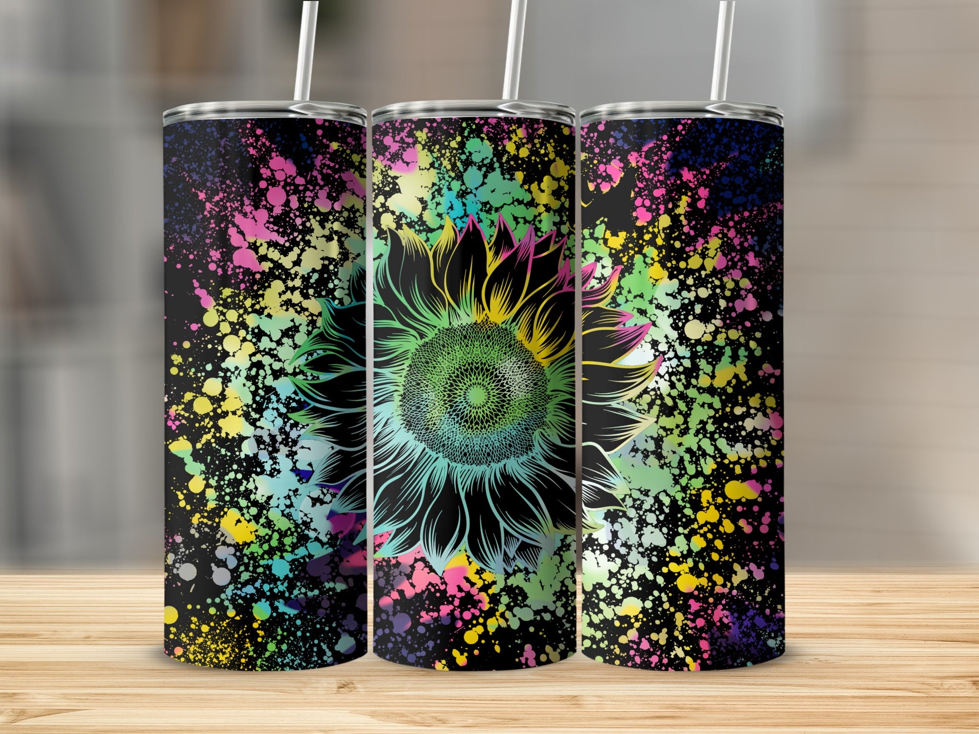 Three tumblers with a black background featuring a colorful paint splatter and a black outline sunflower.
