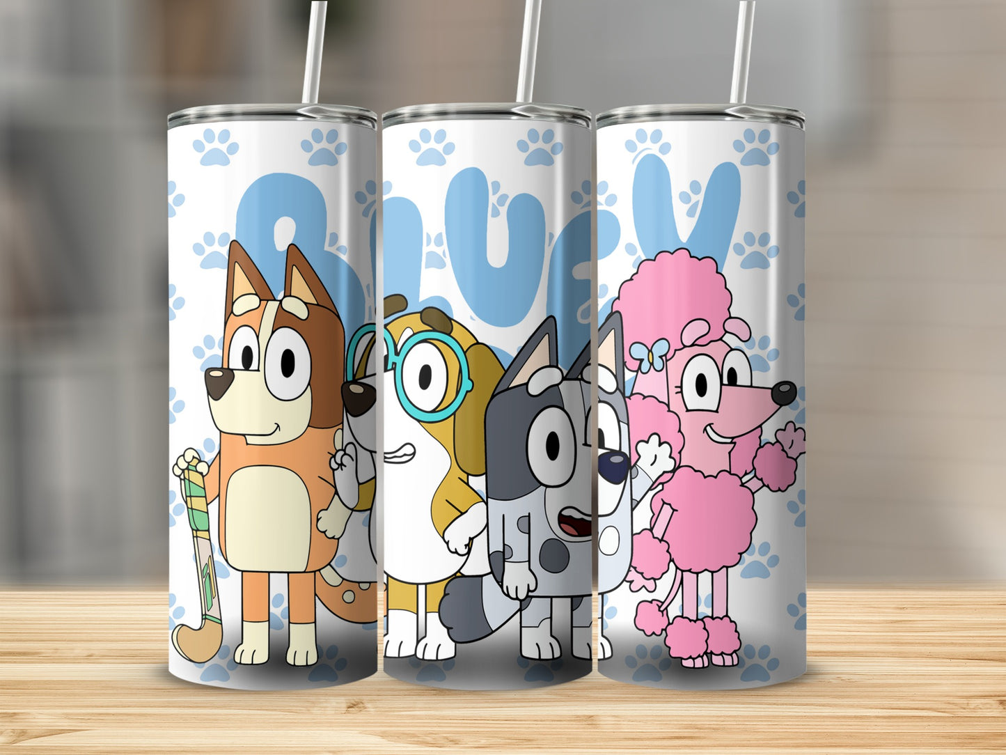 Bluey characters Bandit, Bingo, Bluey, and Coco on a patterned tumbler.