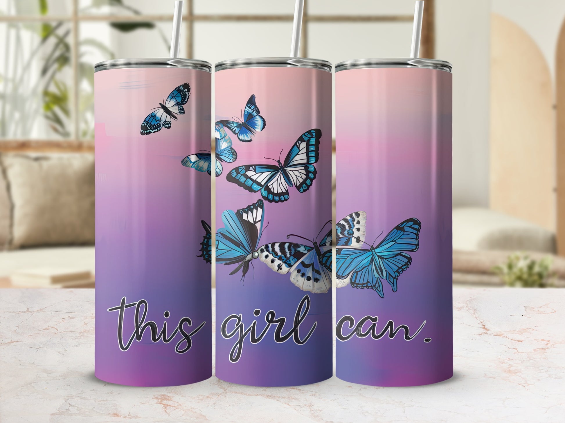 Tumbler with butterflies and text "this girl can" on a gradient background.