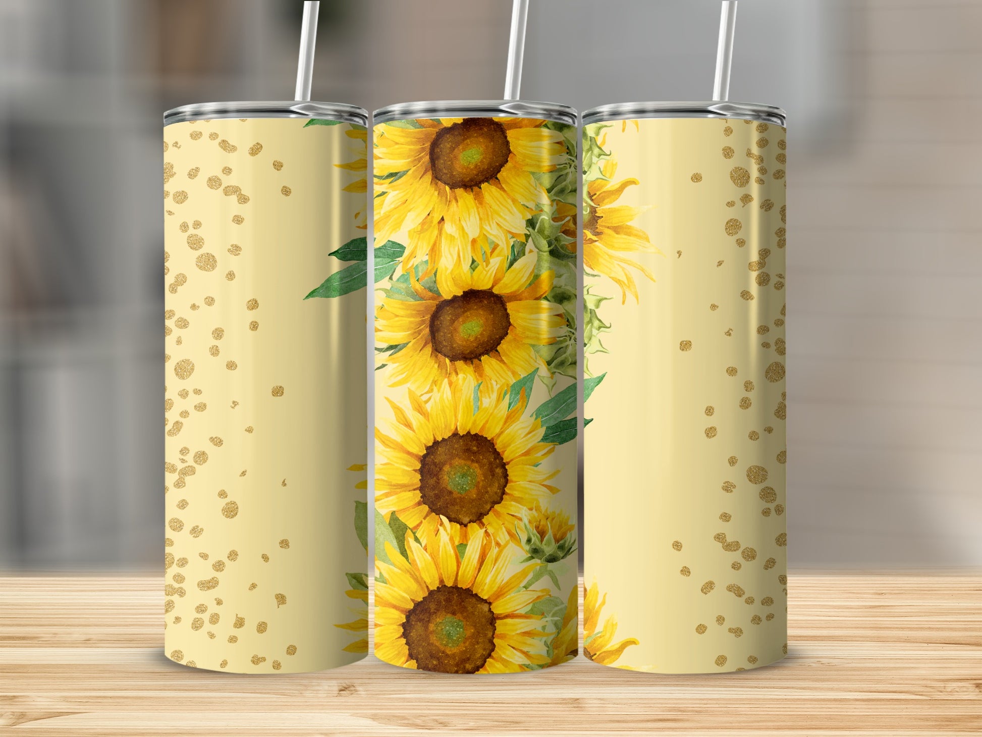 Sunflower pattern tumbler with gold glitter accents on a wooden surface.