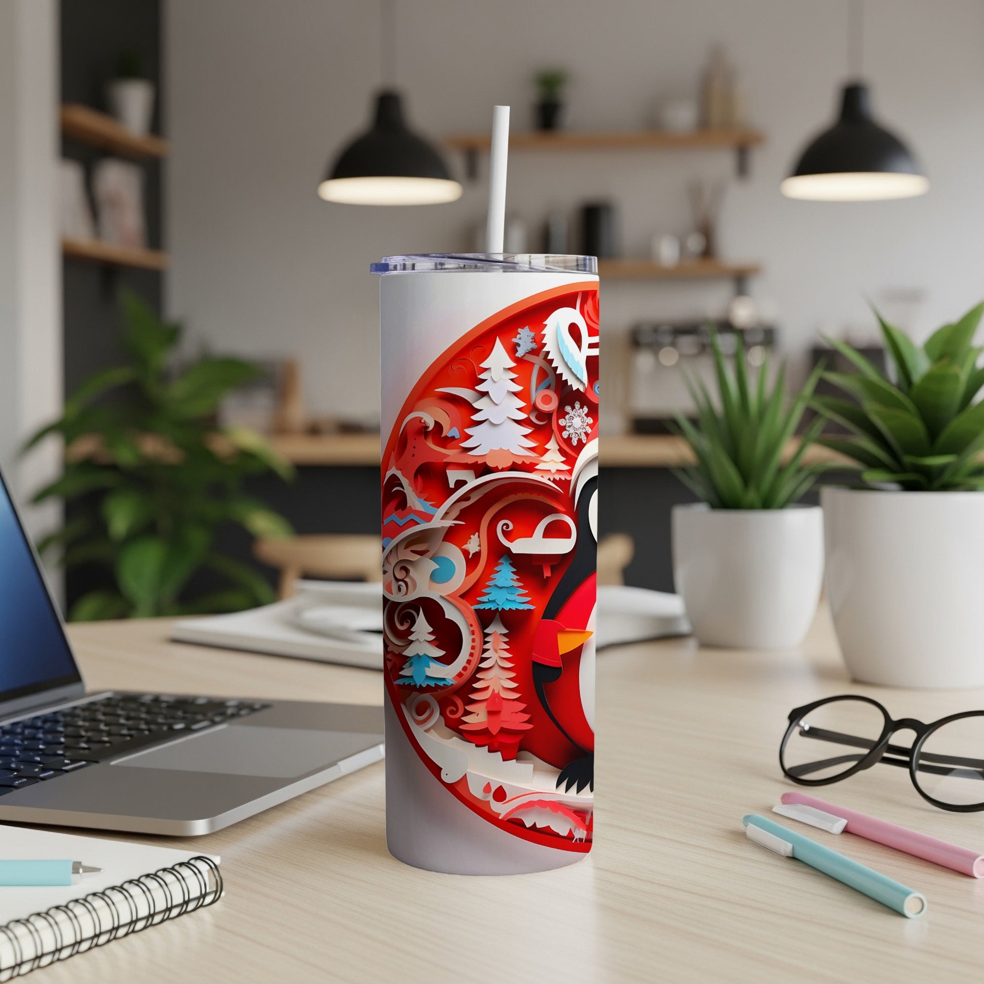 Red and white tumbler with penguin and winter scene design.