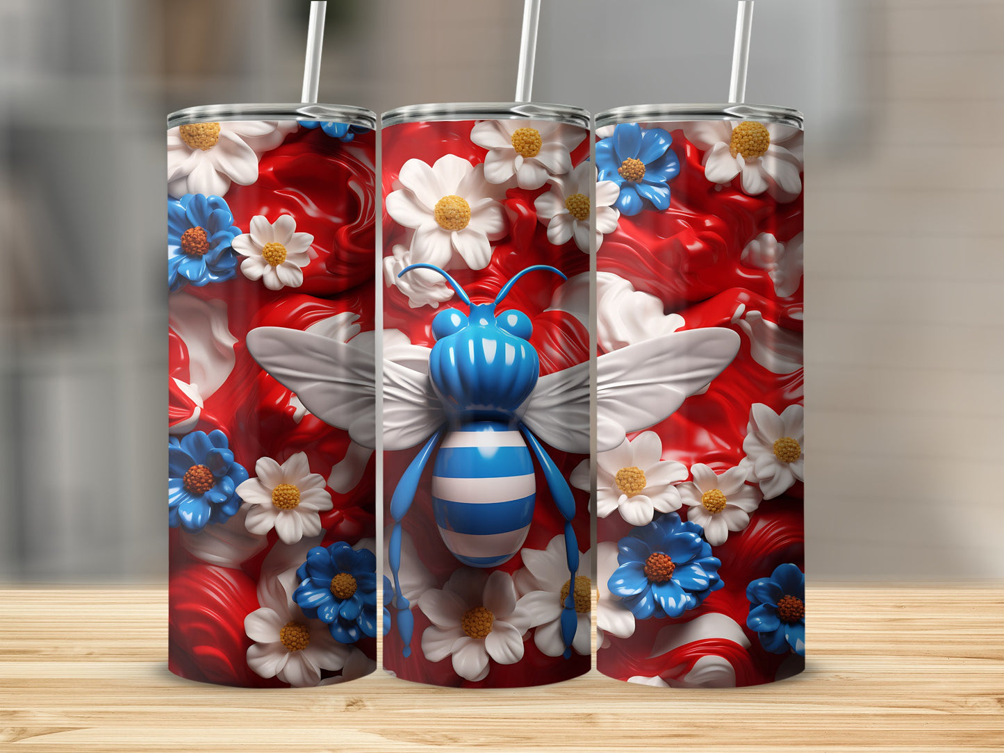 Three tumblers with blue and white striped bees and floral designs.