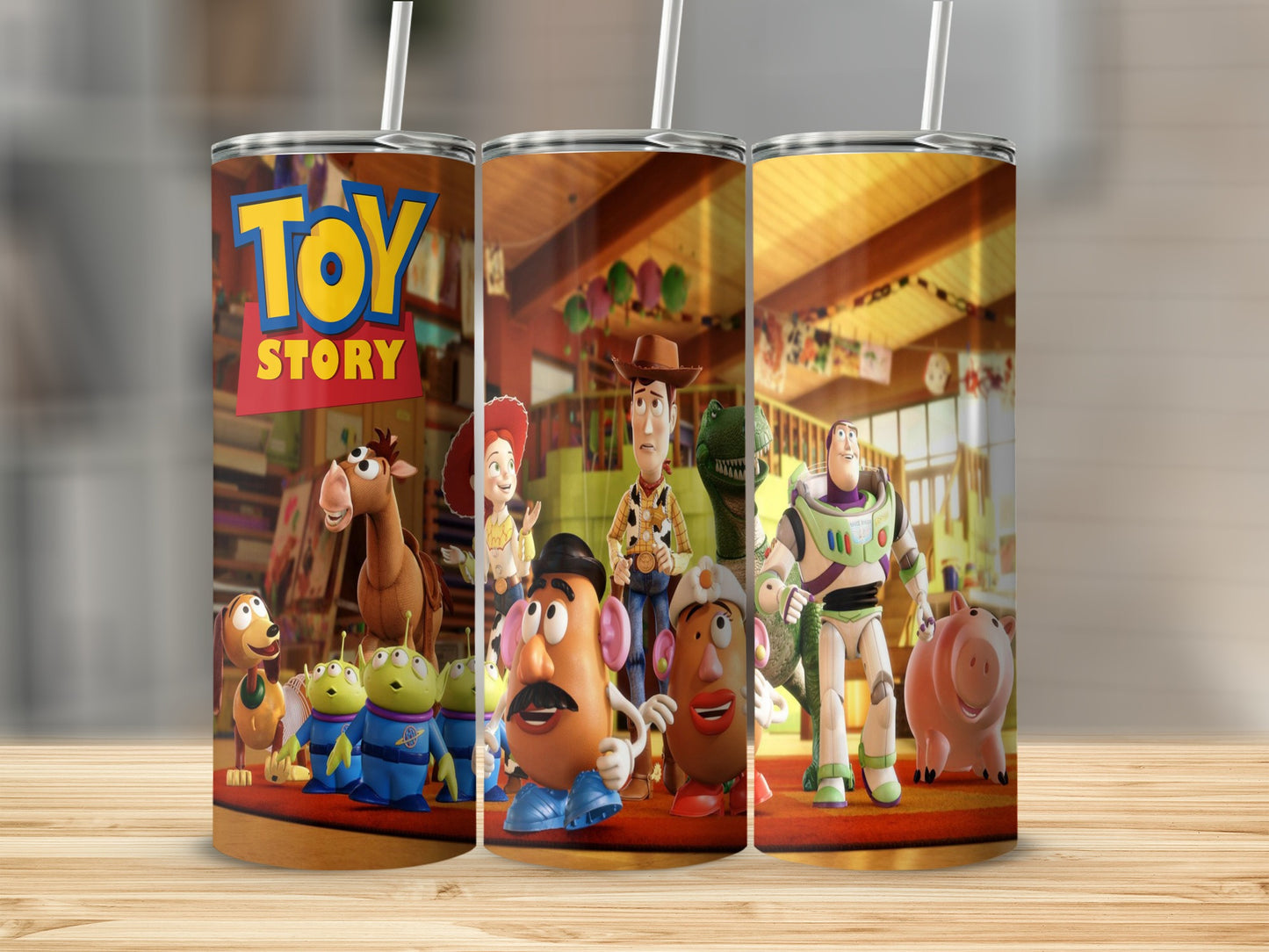 Toy Story characters on a tumbler, featuring Woody, Buzz, and Mr. Potato Head.