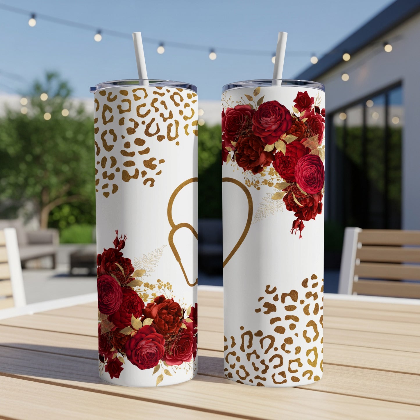 Two white tumblers with red roses, gold hearts, and leopard print patterns.