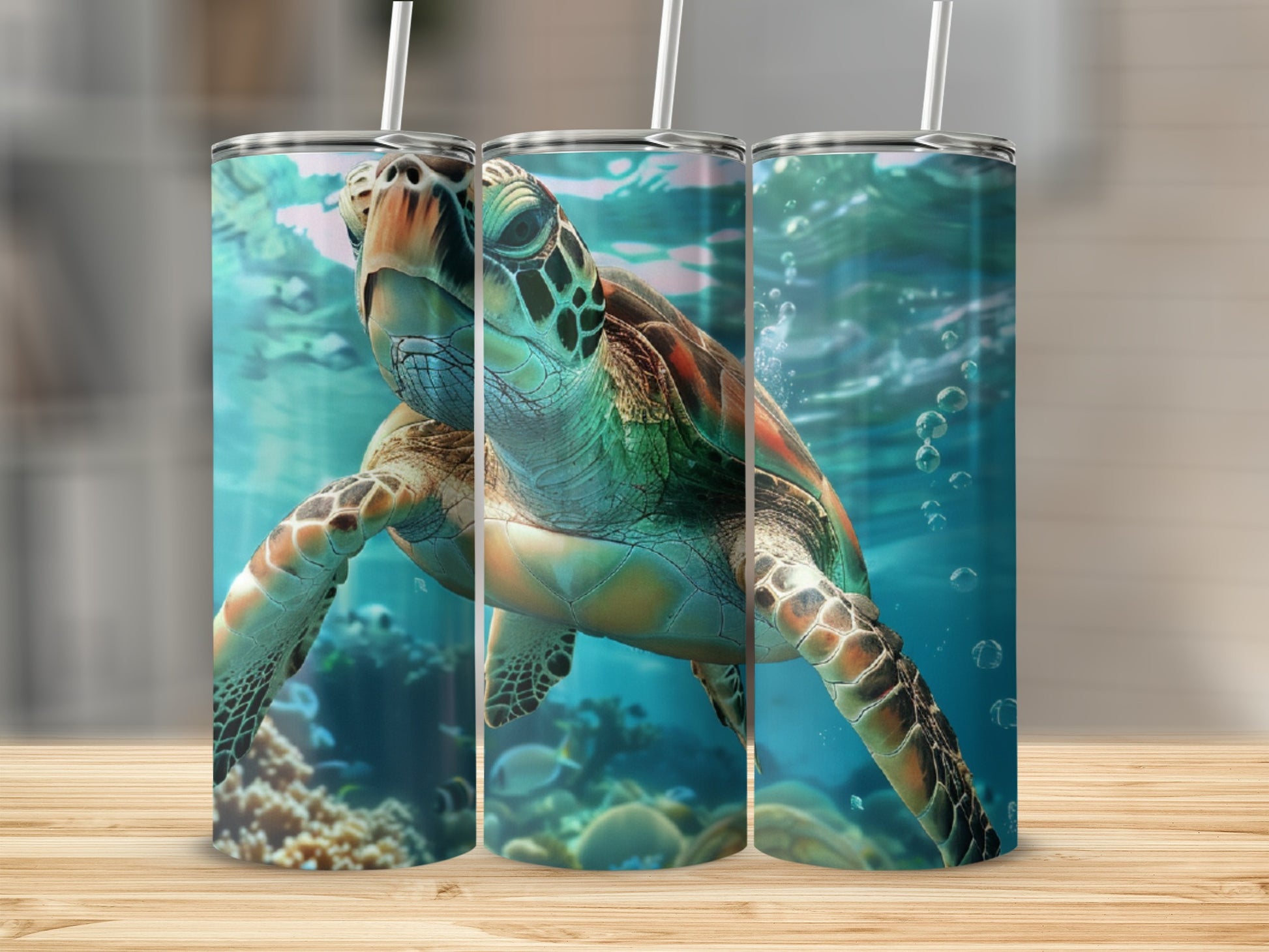 Three tumblers featuring a sea turtle swimming underwater with coral and fish.