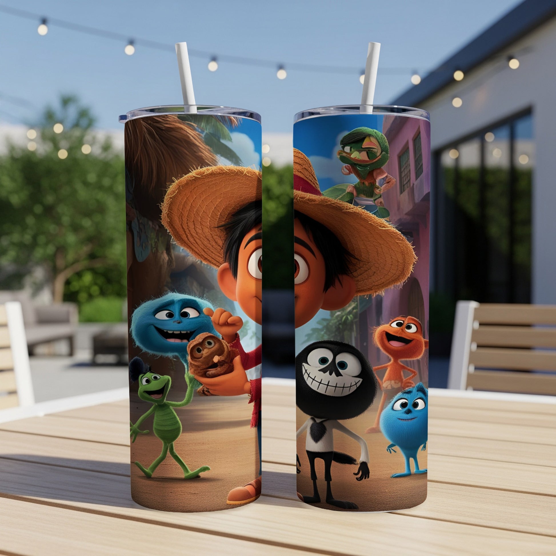 Two tumblers with cartoon characters, including a boy in a straw hat, on an outdoor table.