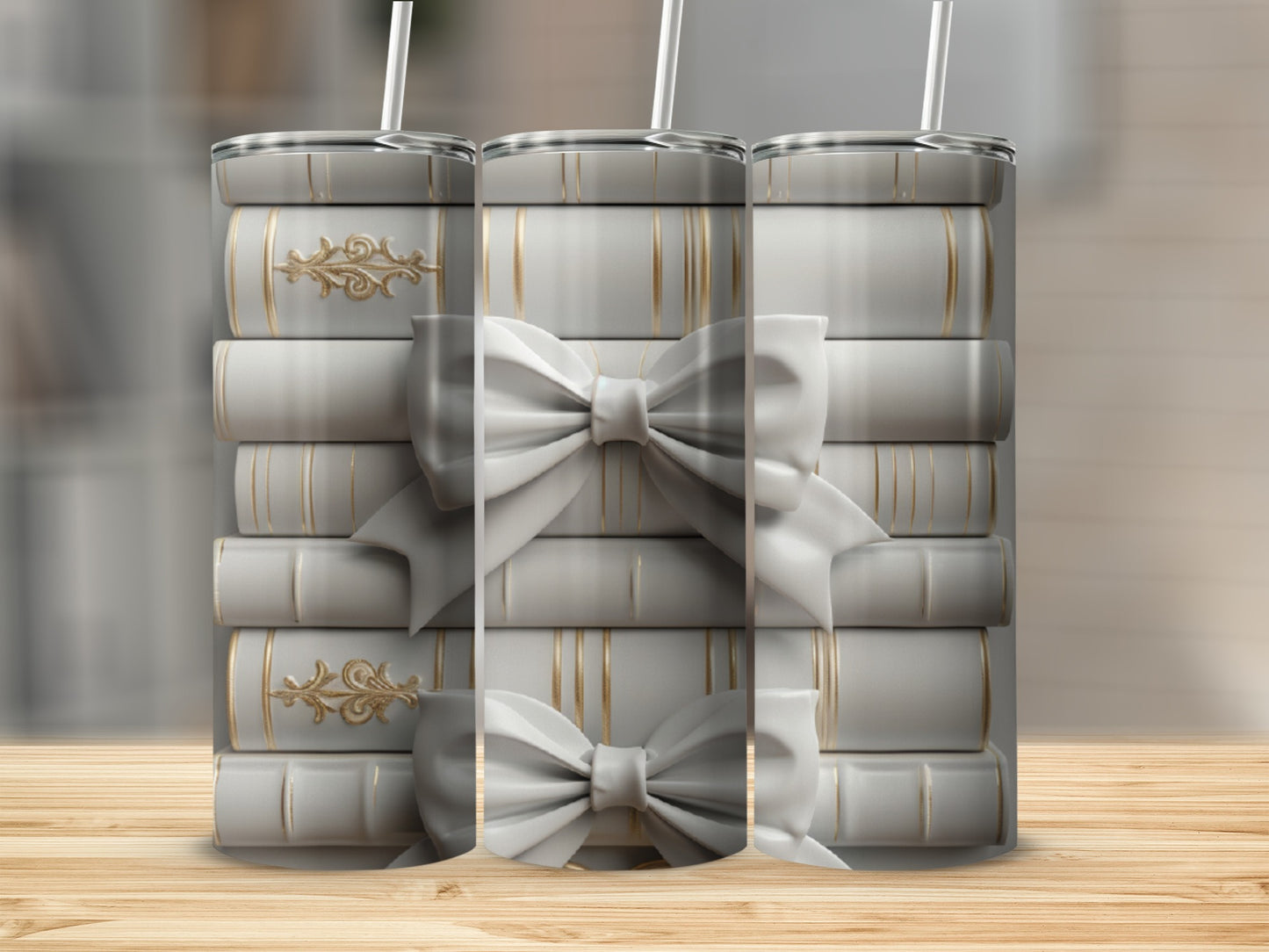 Stack of white books with gold ribbon and bows, with straws.