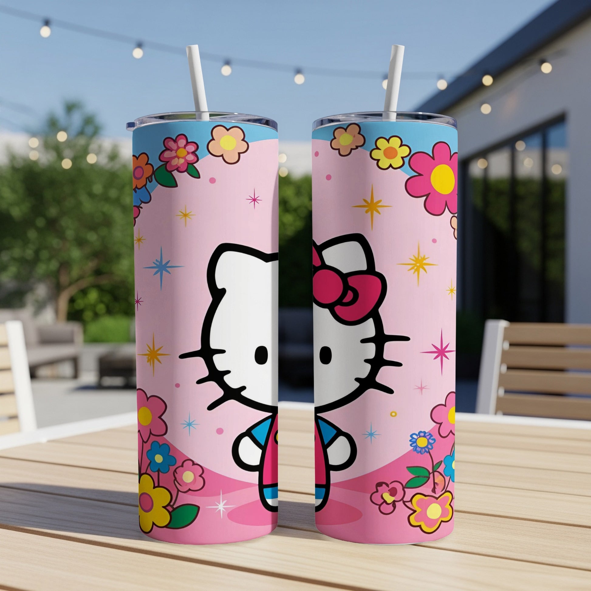 Hello Kitty tumbler with pink background, flowers, and blue accents.