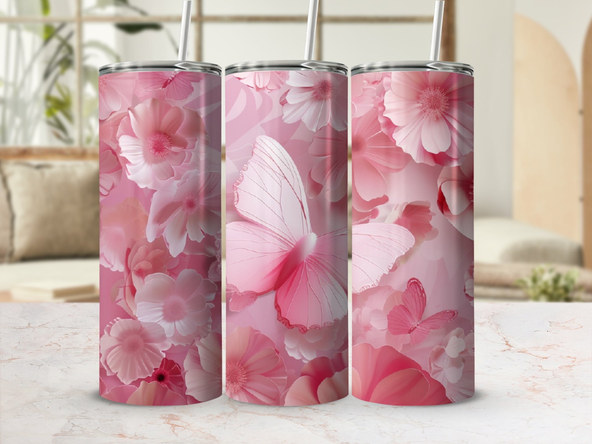 Pink floral and butterfly pattern on a set of three tumblers.