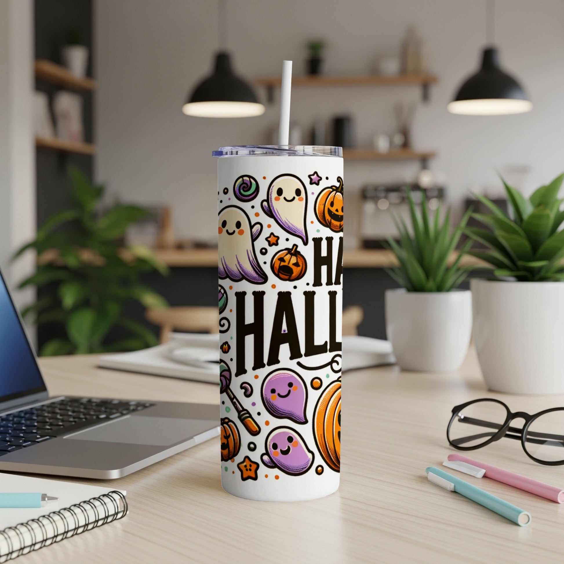 White tumbler with "Happy Halloween" text and cartoon ghosts, pumpkins, and candy.