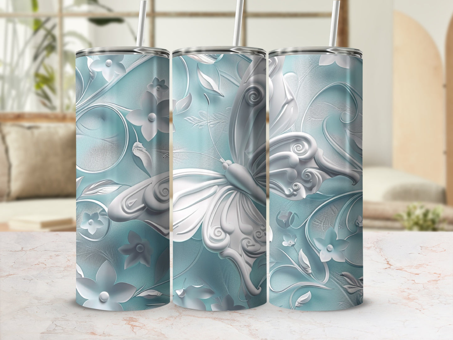Three tumblers with a detailed embossed butterfly and floral design.