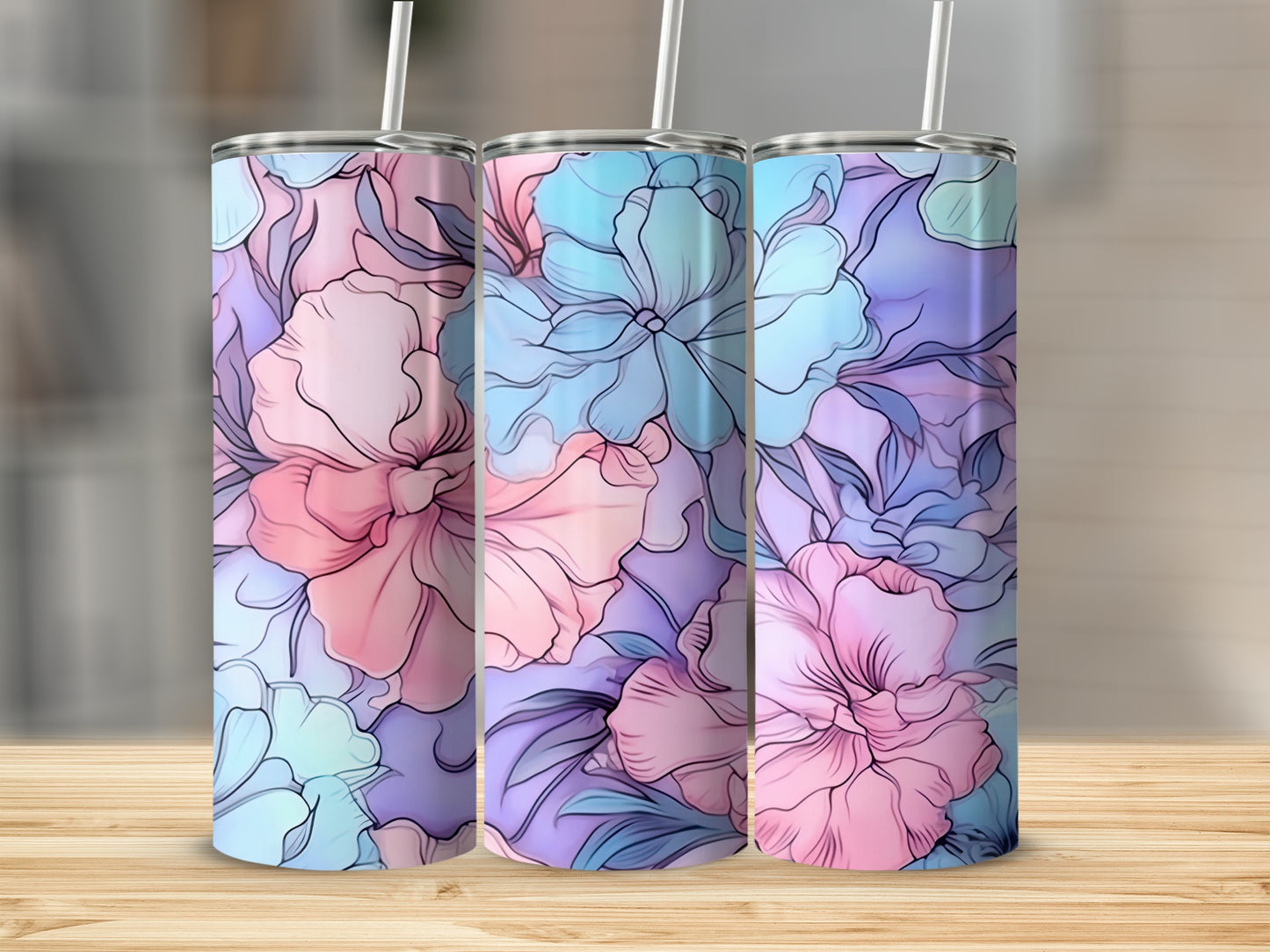 Three tumblers with a floral pattern in pink, blue, and purple.