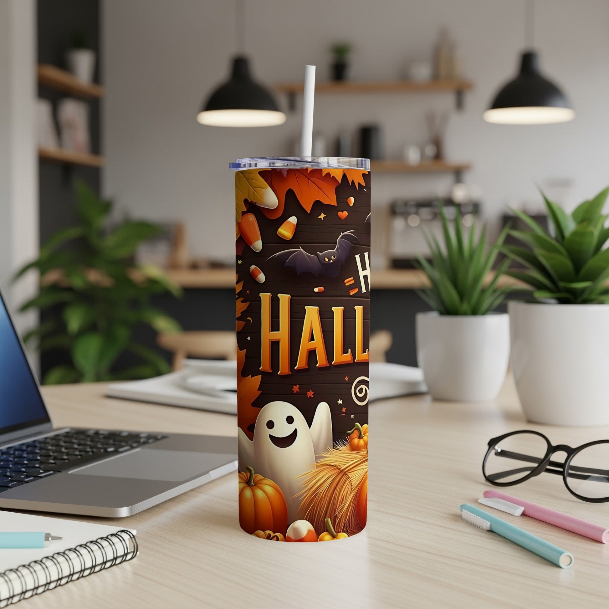 Halloween tumbler with ghost, bat, pumpkins, and candy corn design.