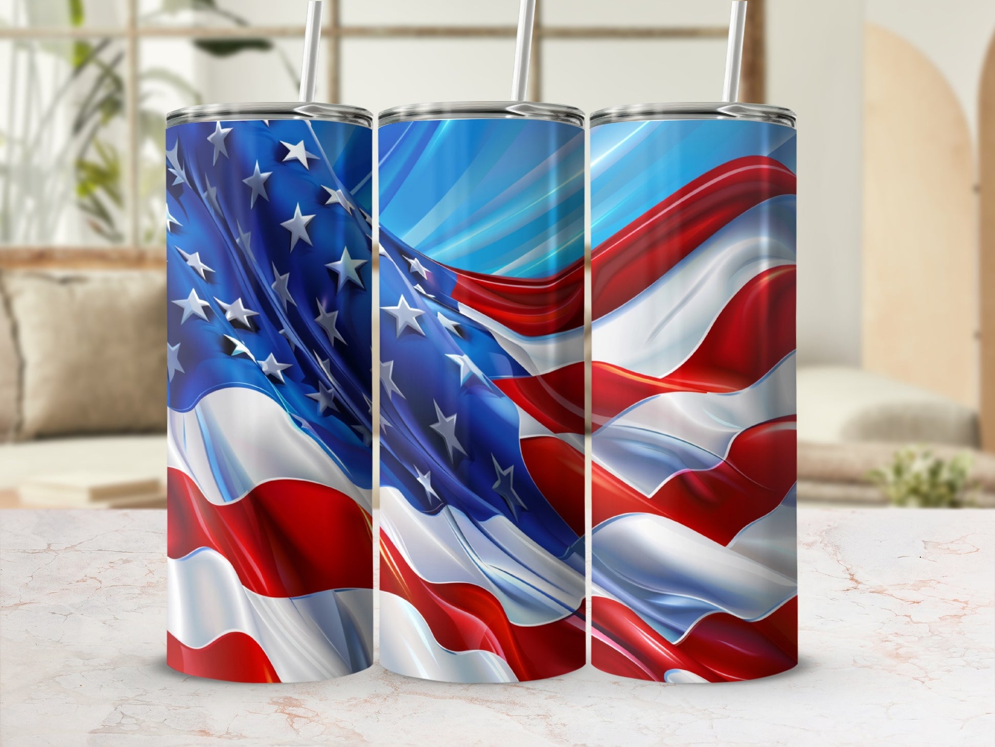 Three tumblers with American flag design on a marble surface.
