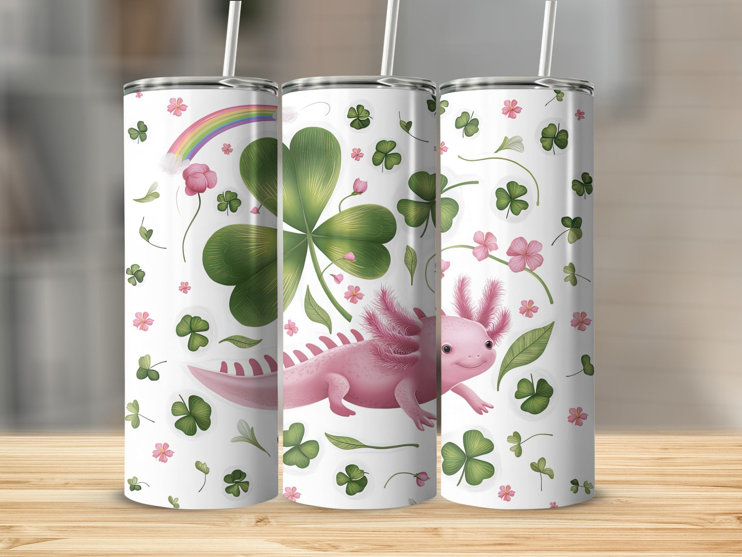 Pink axolotl with shamrocks and rainbow on a white tumbler.