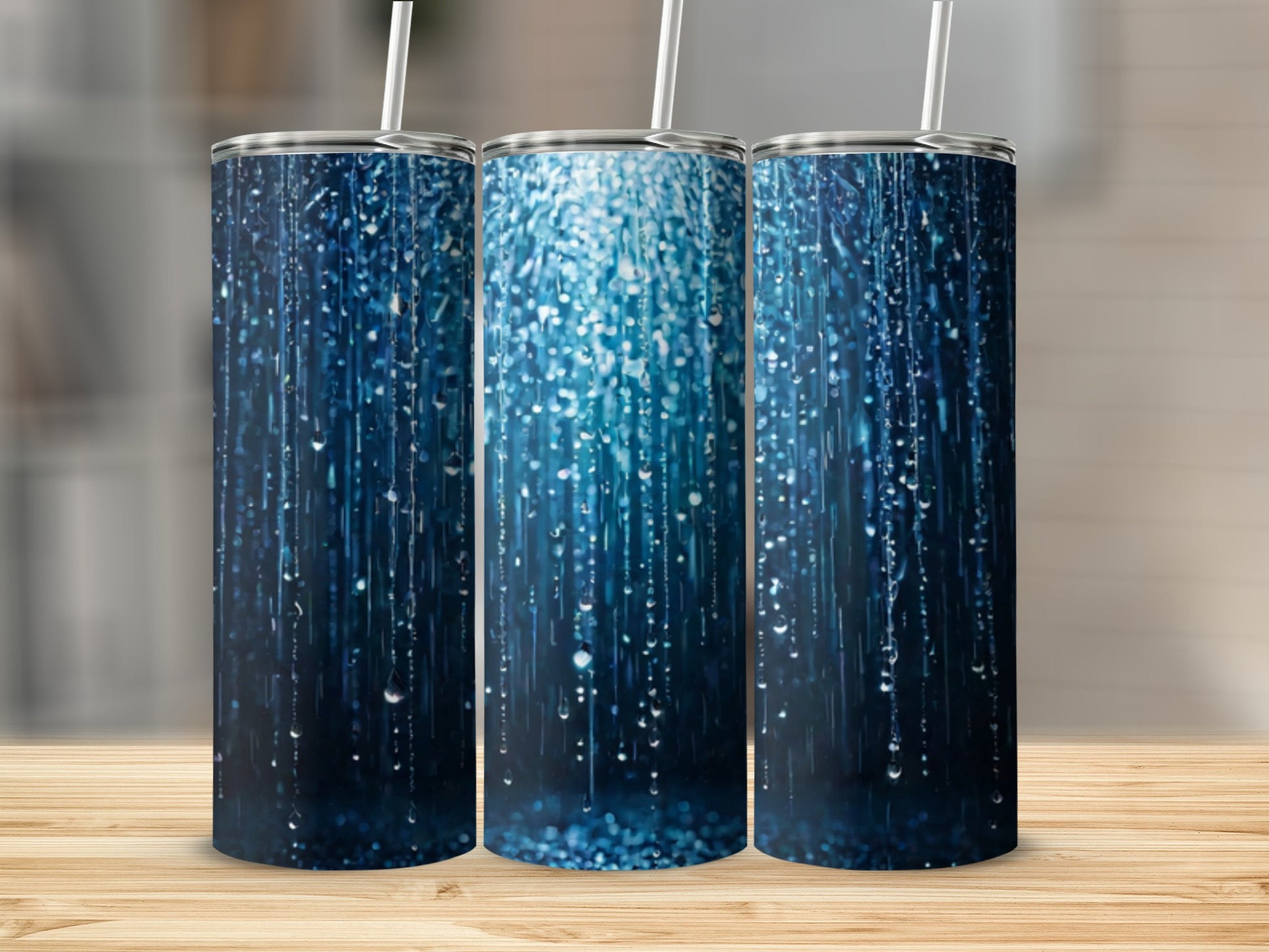 Three tumblers with a shimmering blue water droplet design.