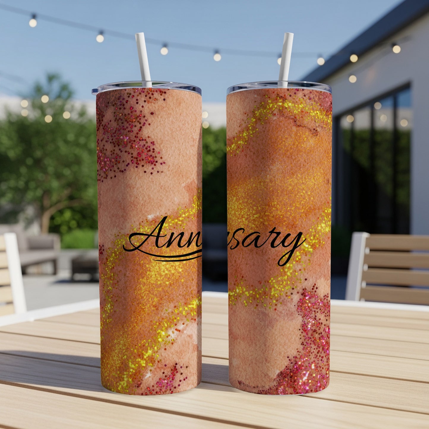 Two tumblers with "Anniversary" text and sparkling glitter.