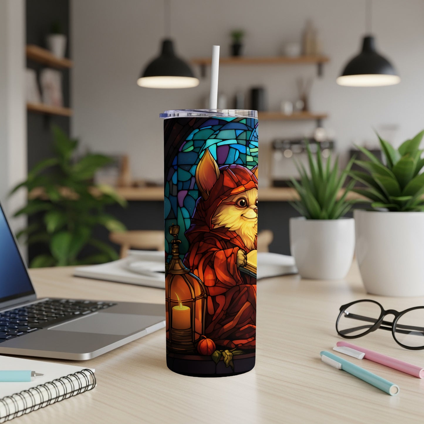 Tumbler with a cartoon cat in a red robe holding a book with stained glass background.