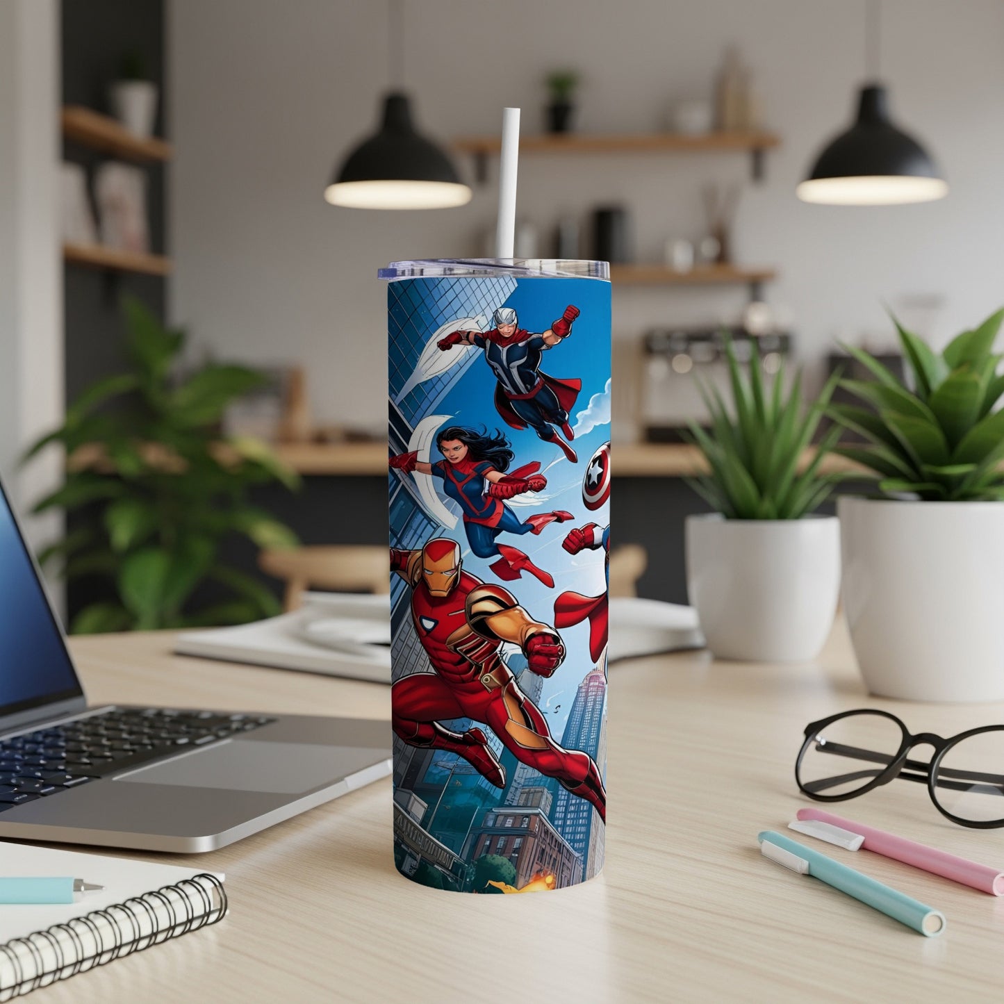 Marvel superheroes Captain America, Iron Man, and Ms. Marvel on a tall, blue tumbler.