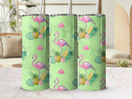 Green polka dot tumbler with flamingos, pineapples, and palm leaves.