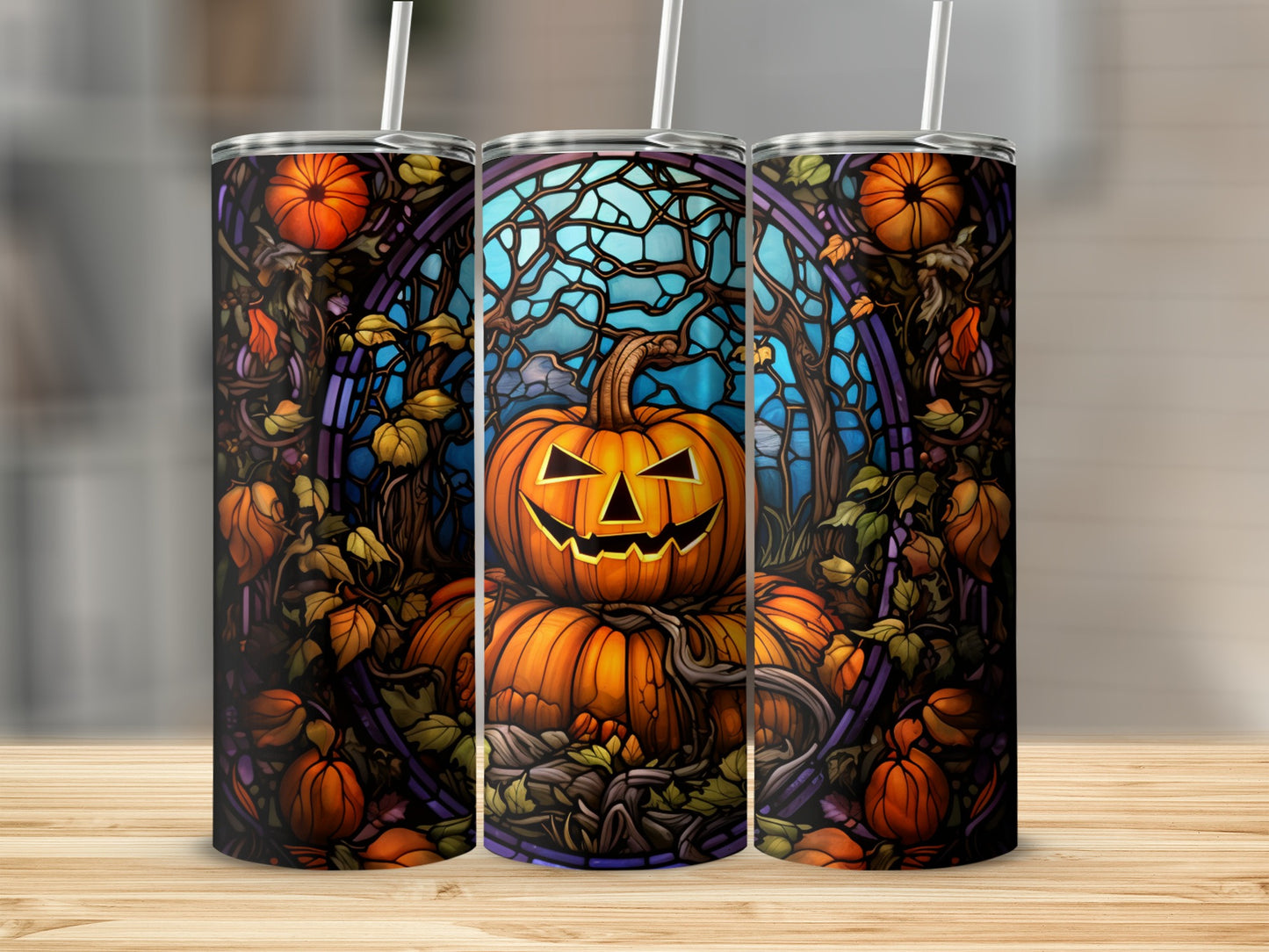 Three tumblers with Halloween pumpkins, stained glass, and vines.