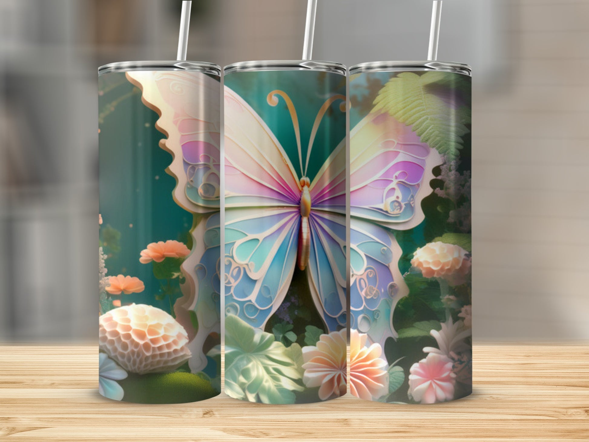 Three tumblers featuring a colorful butterfly and floral design.