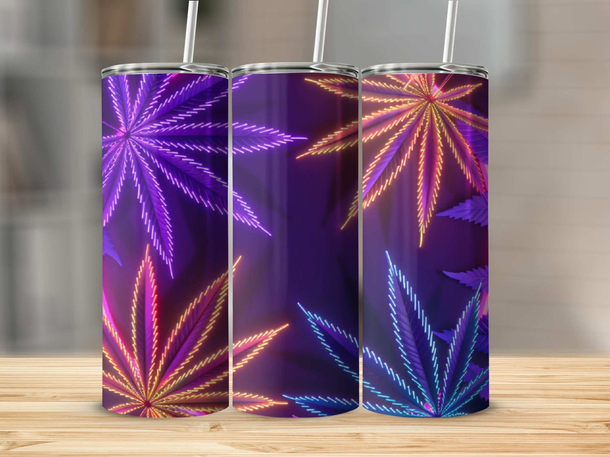 Three tumblers with glowing cannabis leaf designs in purple and yellow.