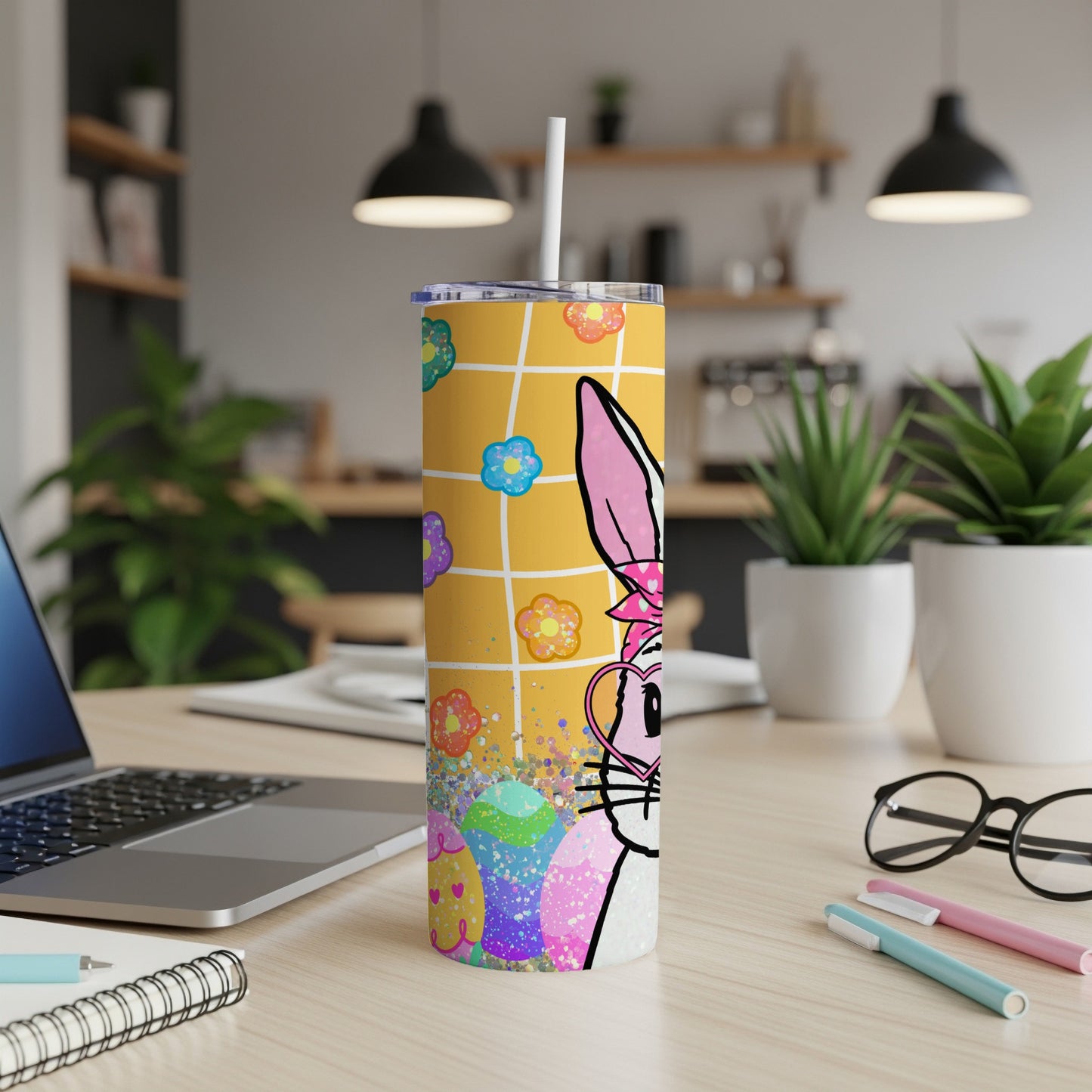 Yellow patterned tumbler with Easter bunny, eggs, and flowers.