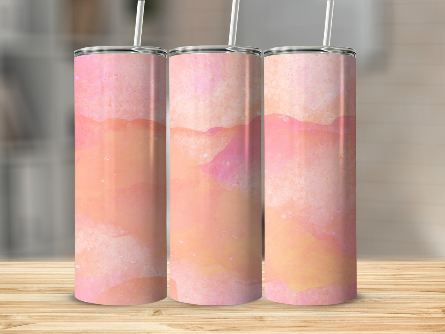 Three tumblers with a watercolor wash of pink, orange, and yellow.