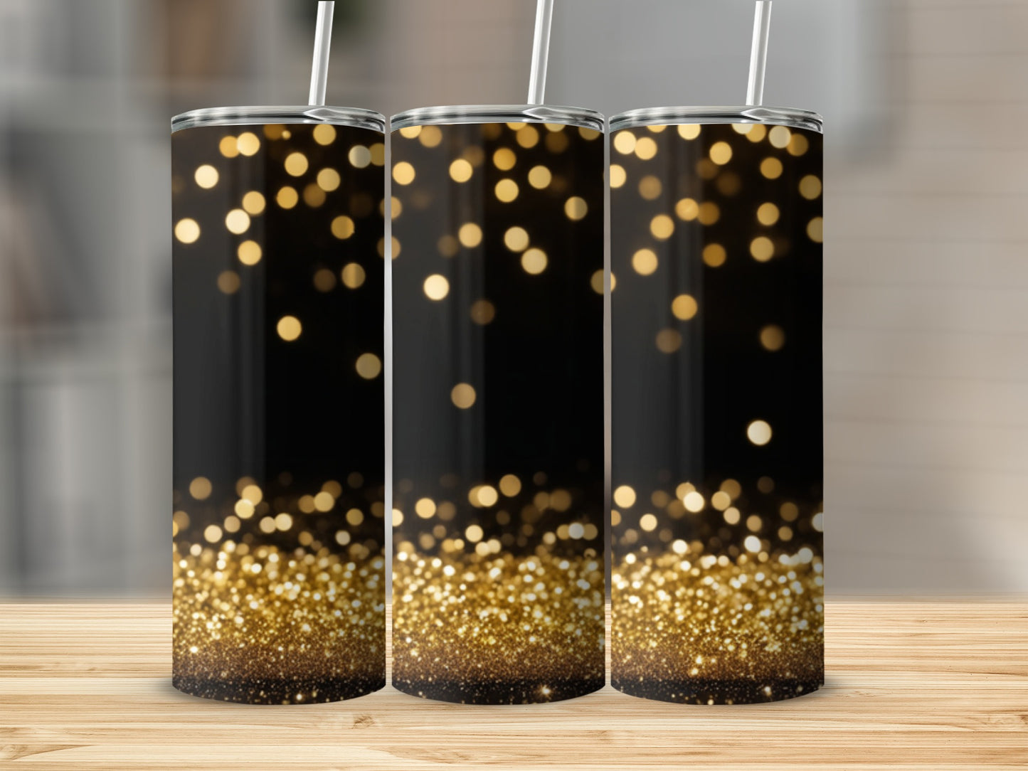Three tumblers with a black background and sparkling gold bokeh lights.