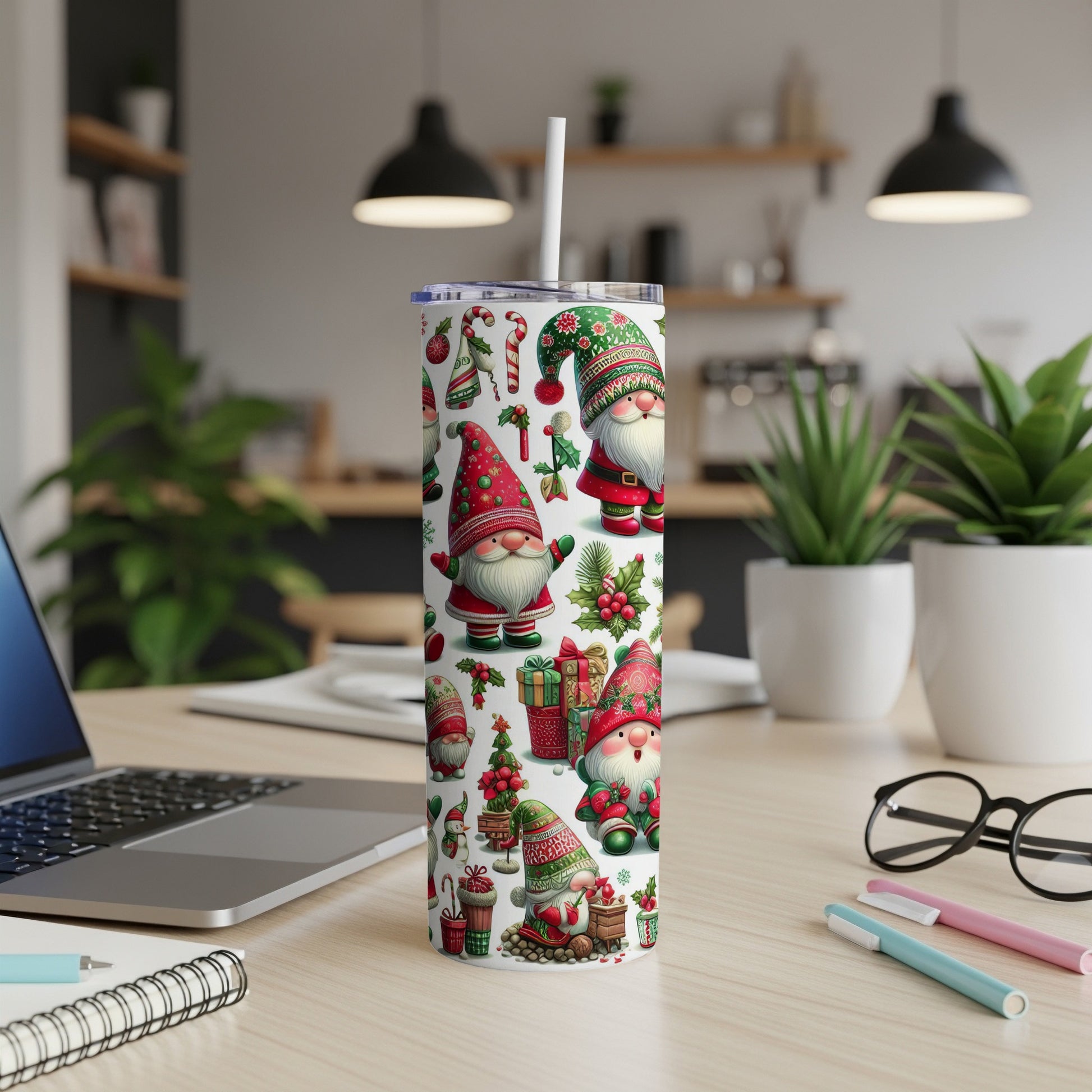 Christmas gnomes and candy canes adorn this white tumbler with a straw.