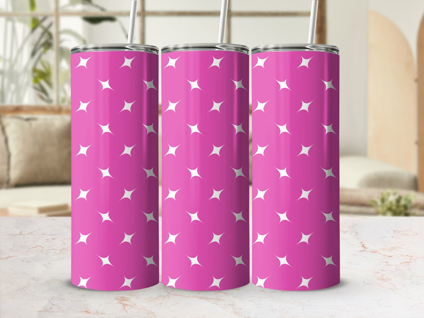 Pink tumbler with white stars pattern.