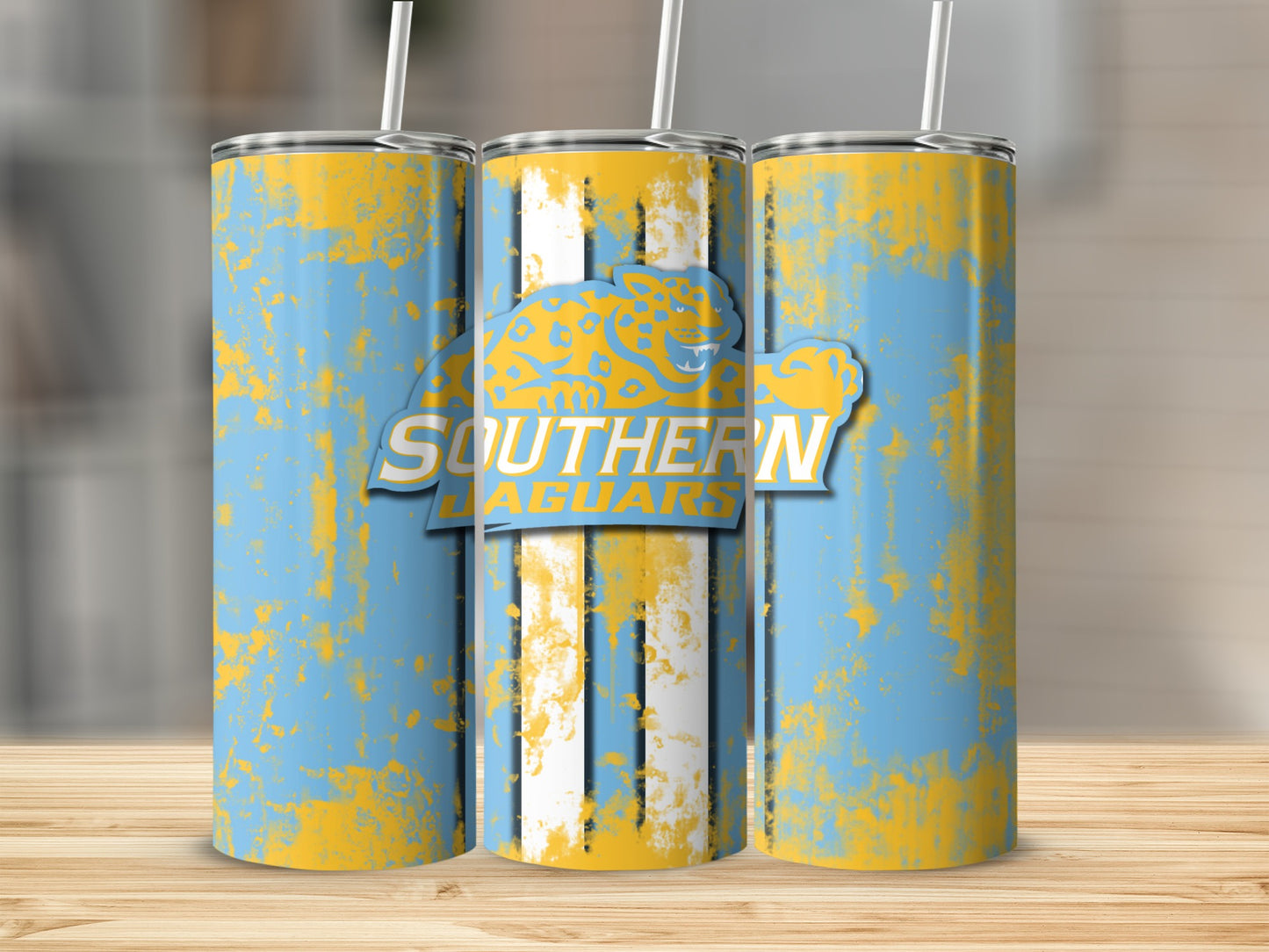 Three tumblers with a distressed light blue and yellow pattern and "SOUTHERN JAGUARS" text.