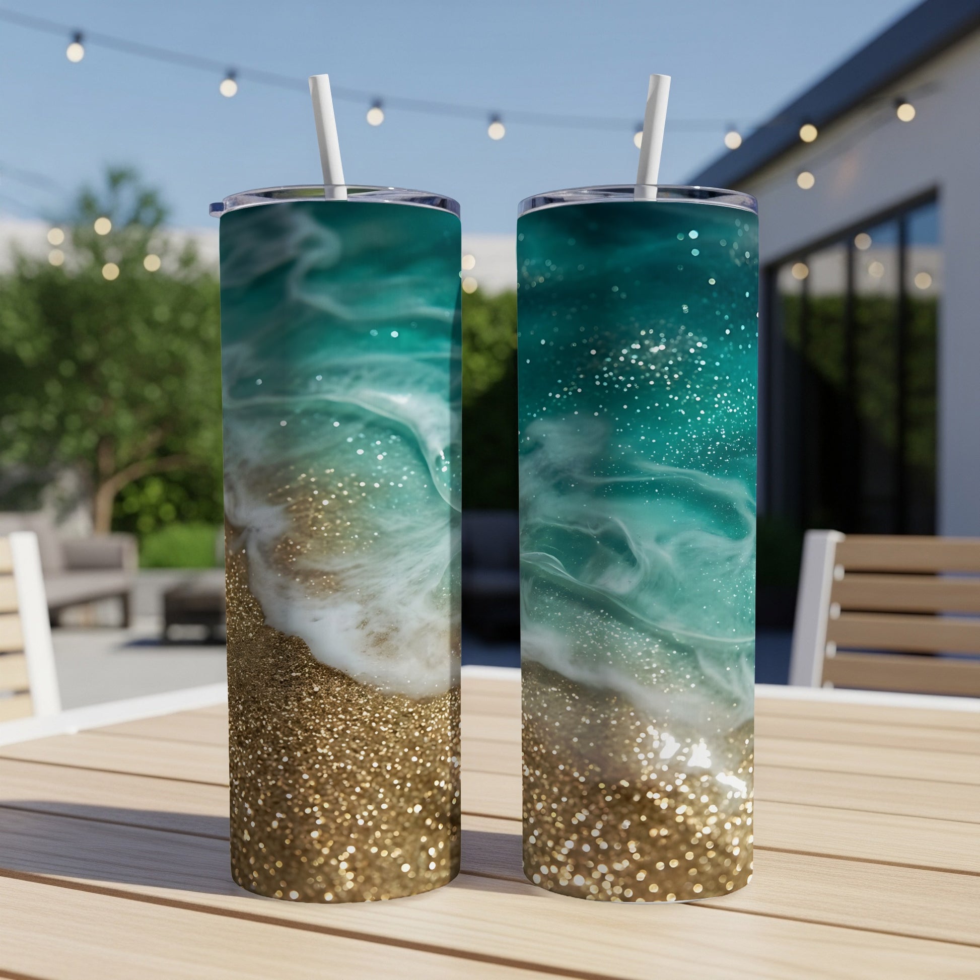 Two tumblers with a resin art design of ocean waves and glitter.