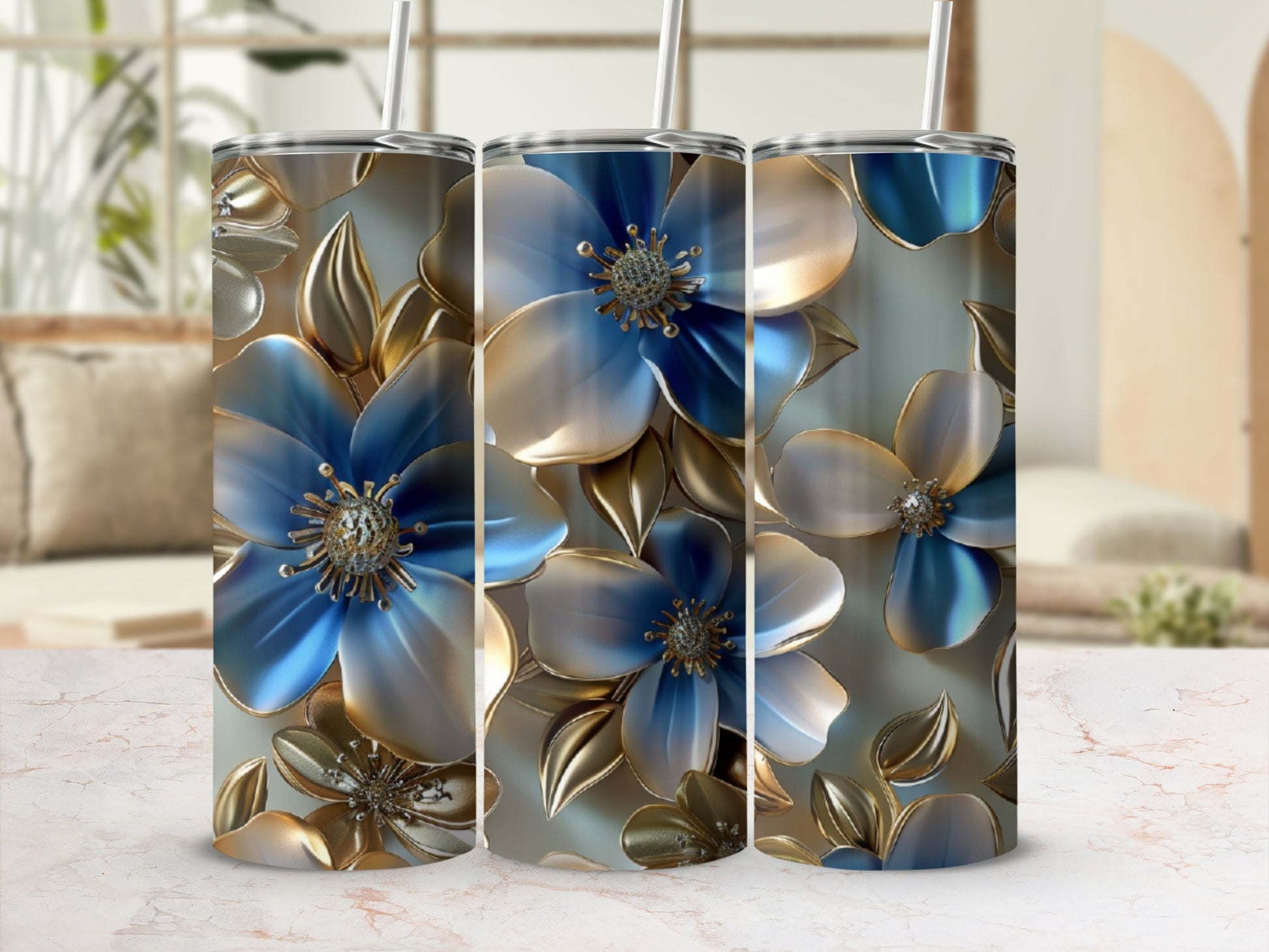 Three tumblers with blue and gold metallic floral designs.