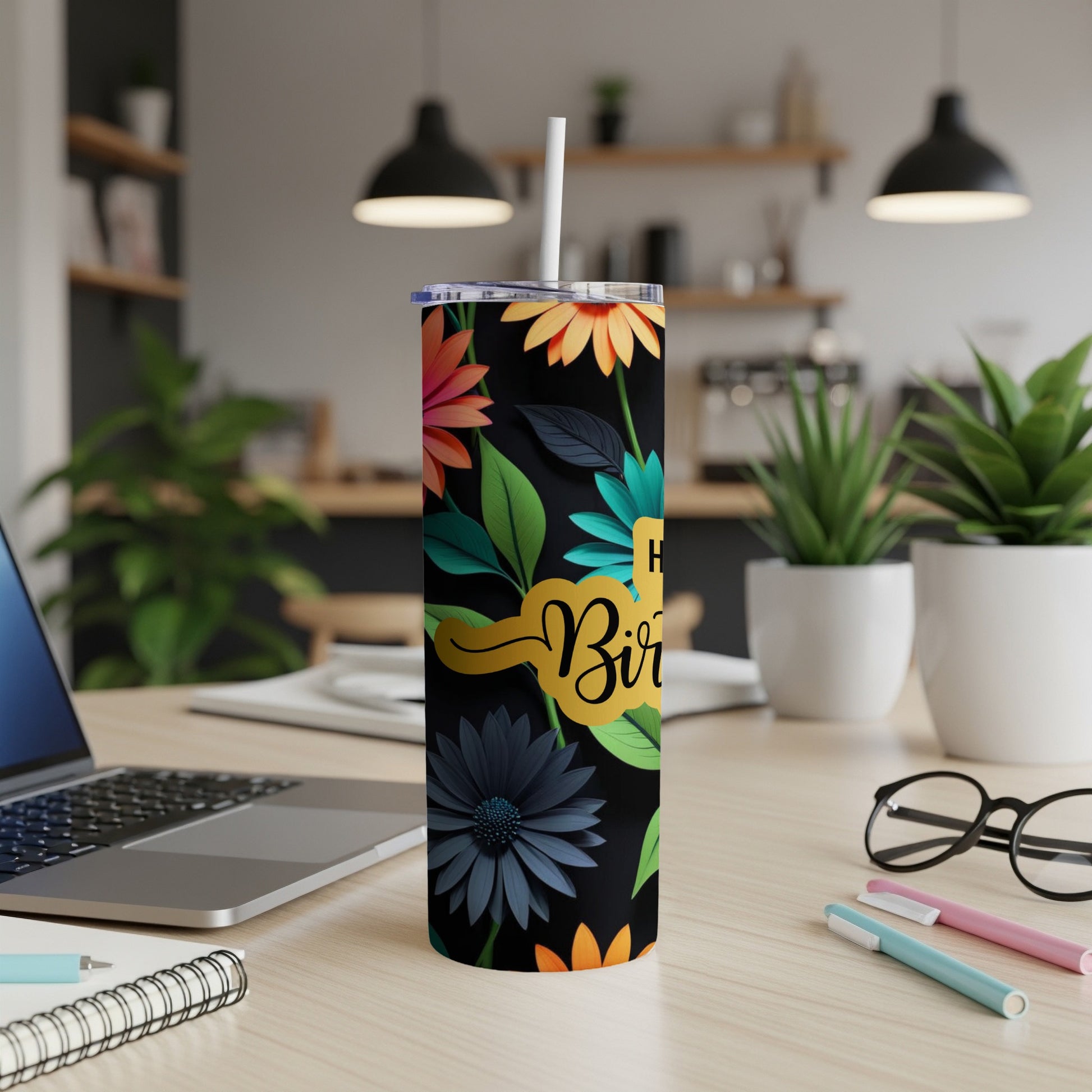 Tall tumbler with "Happy Birthday" text and floral pattern.