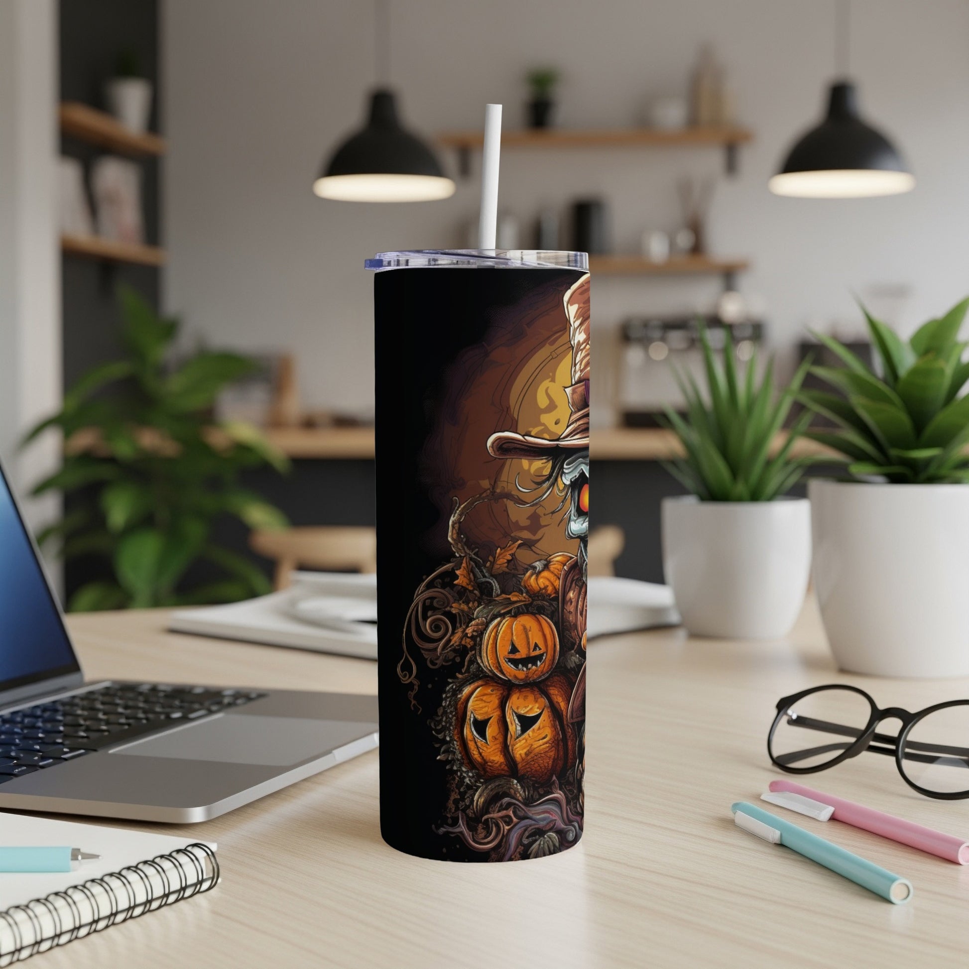 Tall tumbler with Halloween-themed art featuring a skull, pumpkins, and fall leaves.