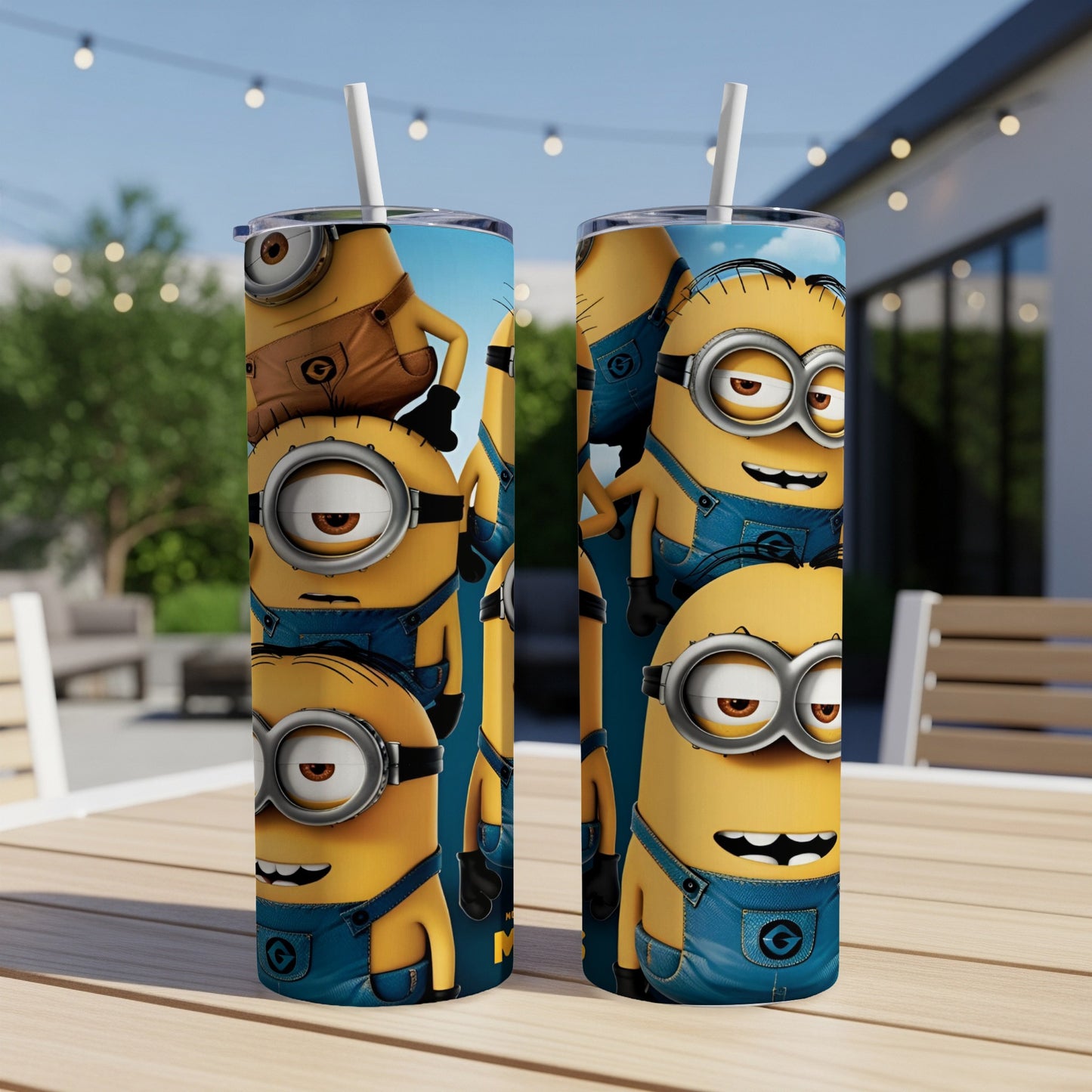 Two Minions wearing blue overalls and goggles on a tumbler cup.