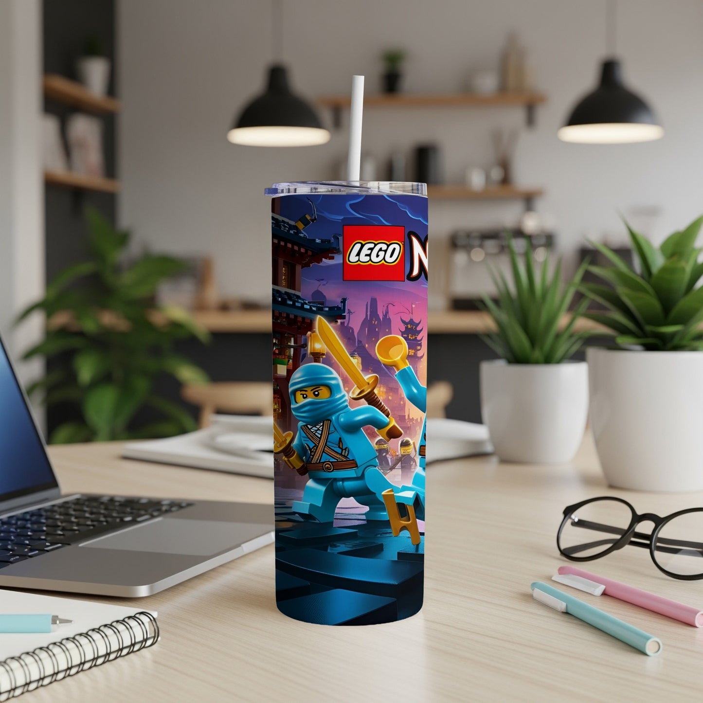 LEGO Ninjago tumbler with Kai and Jay holding swords, on a desk.